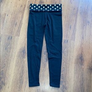 ‘PINK’ leggings. Black with gold hearts on band